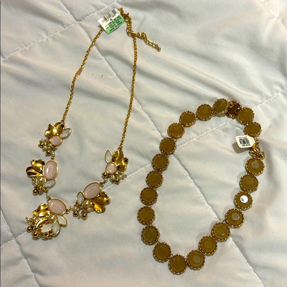 Two necklaces with tags still attached